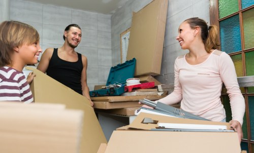Student removals team planning a move in a Canary Wharf apartment building