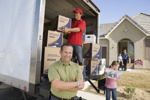 Careful loading of boxes and furniture for a Canary Wharf apartment relocation