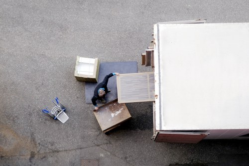 Man and van team working in Canary Wharf near modern apartment towers