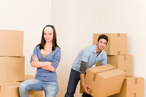 Local office movers handling desks and boxes near Canary Wharf